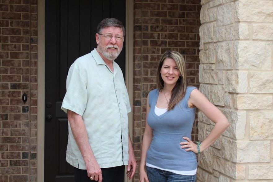 George Bostock III and his daughter and partner Jenny Norris standing at the front door of an East Texas home